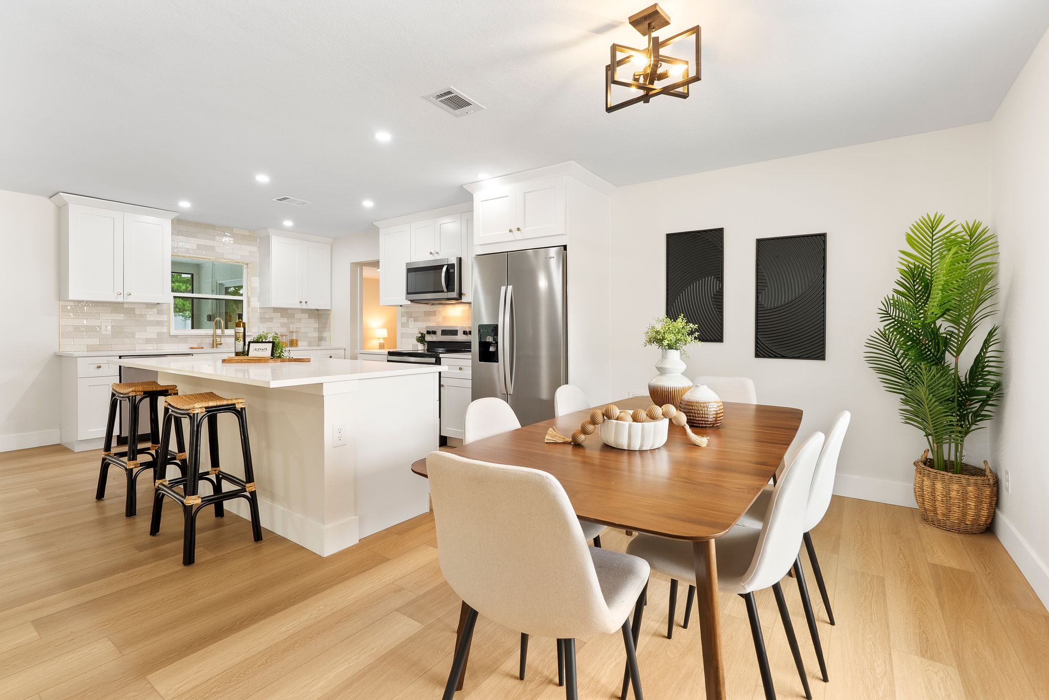 Kitchen and dining after - open concept, modern finishes, oak flooring